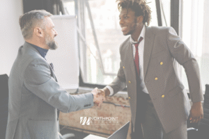 Photo of two men shaking hands